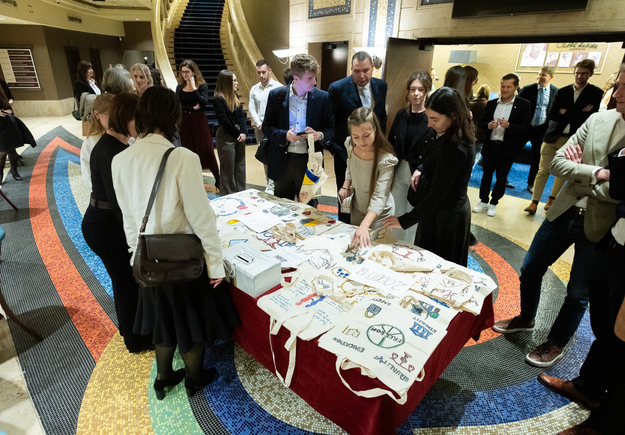Guests browsing handmade items in the theatre lobby