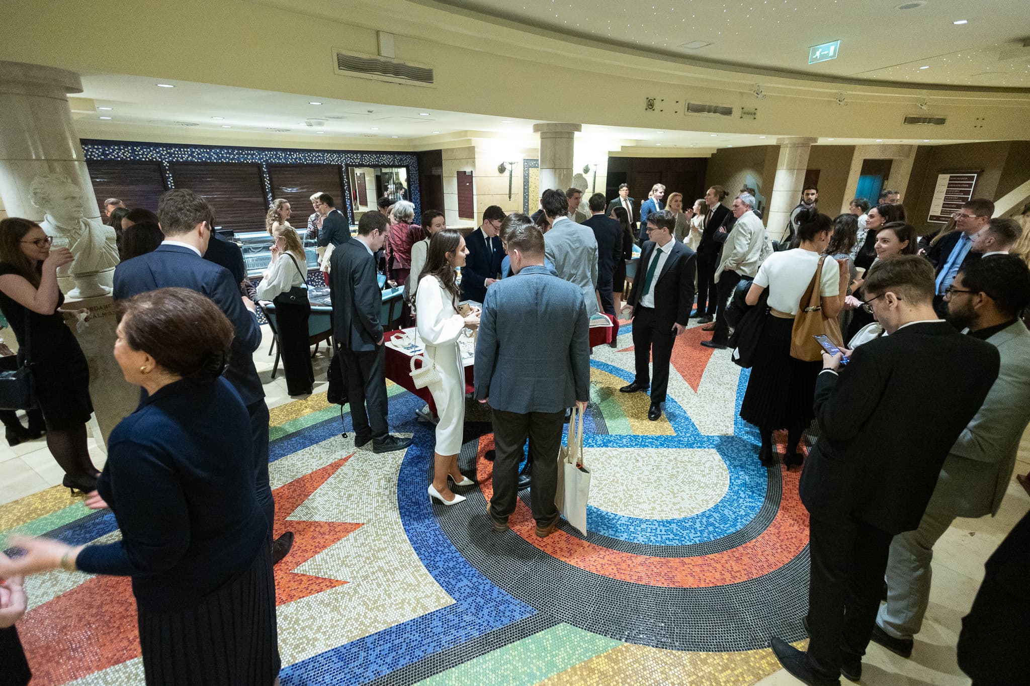 Guests mingling in the National Theatre lobby