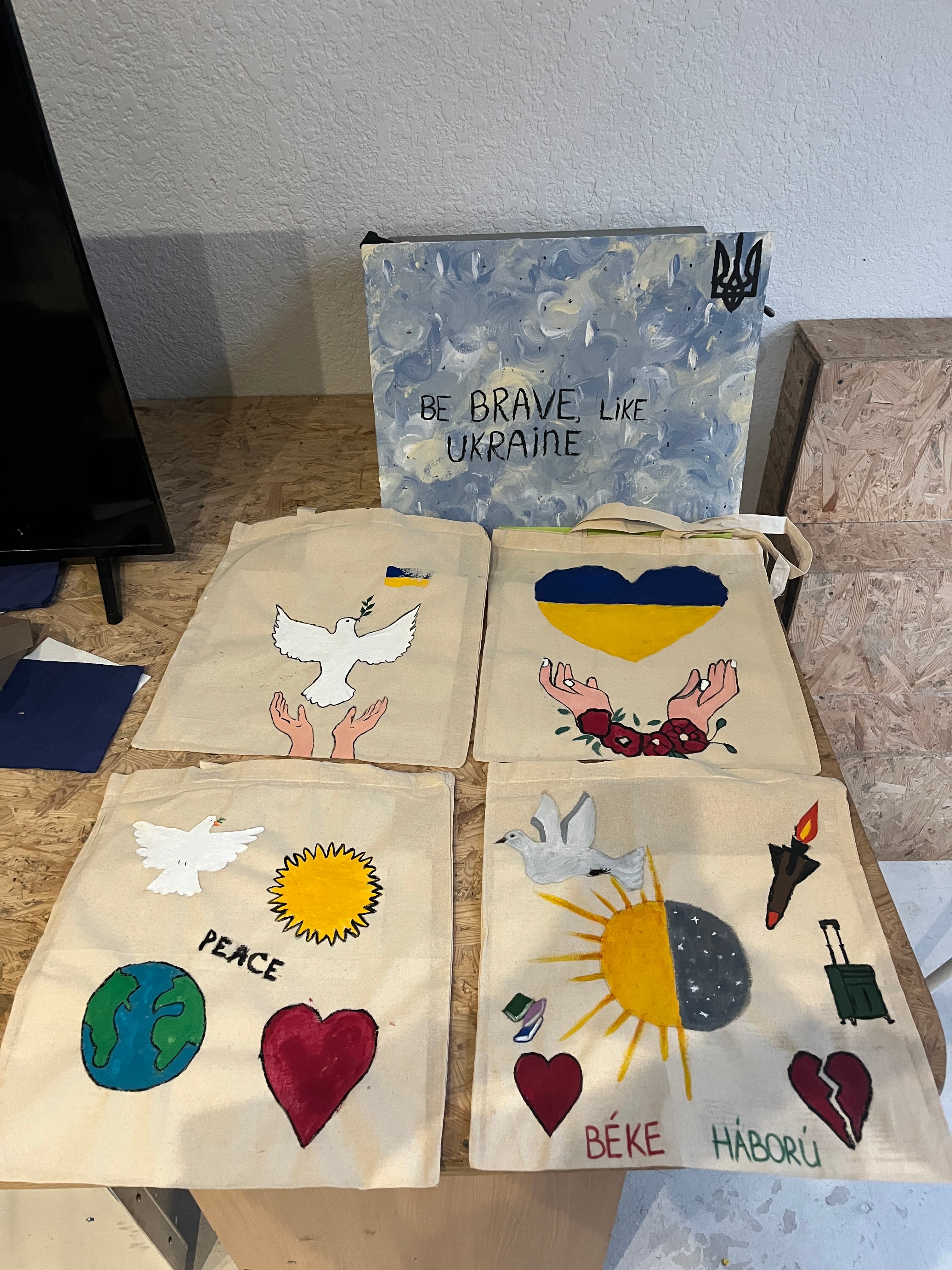 Close-up of painting activity with peace symbols