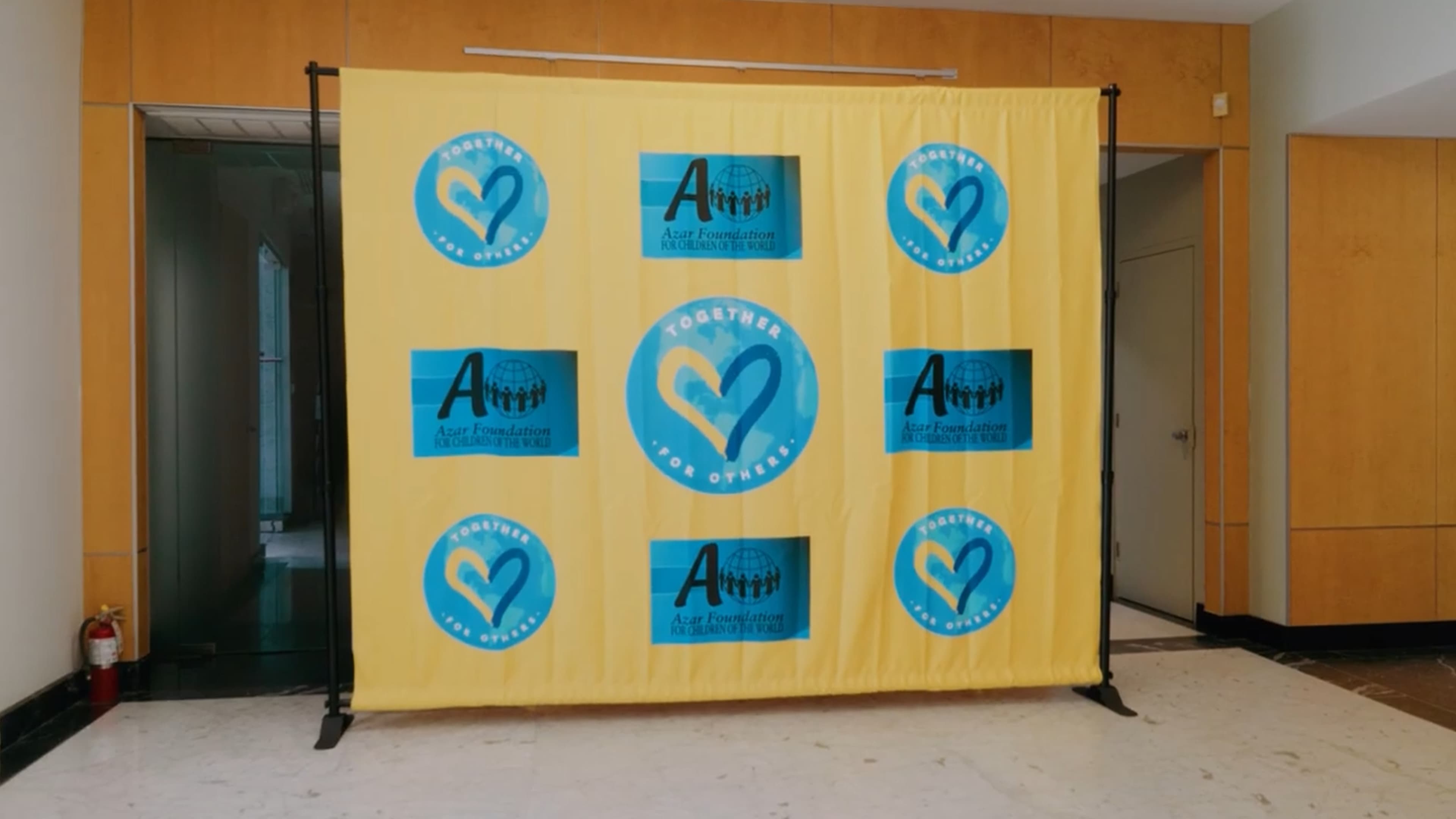 Together for Others and Azar Foundation event backdrop
