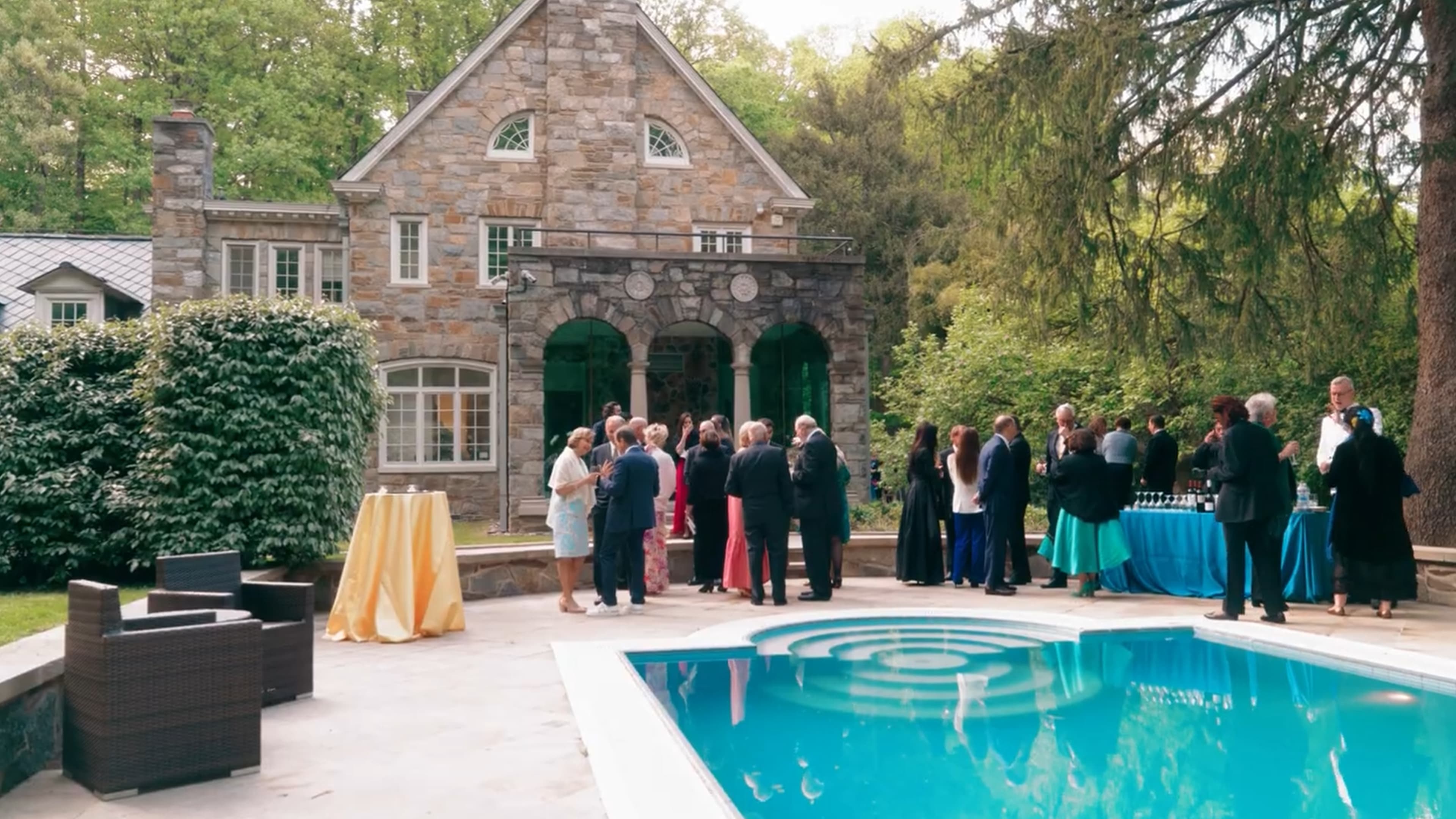 Guests gathering by the pool at the Czech Embassy