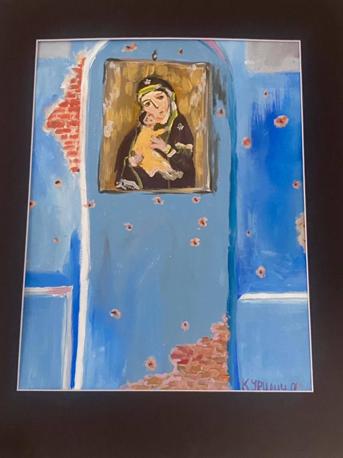 A bullet-scarred icon on a blue wall — painted by a Ukrainian child