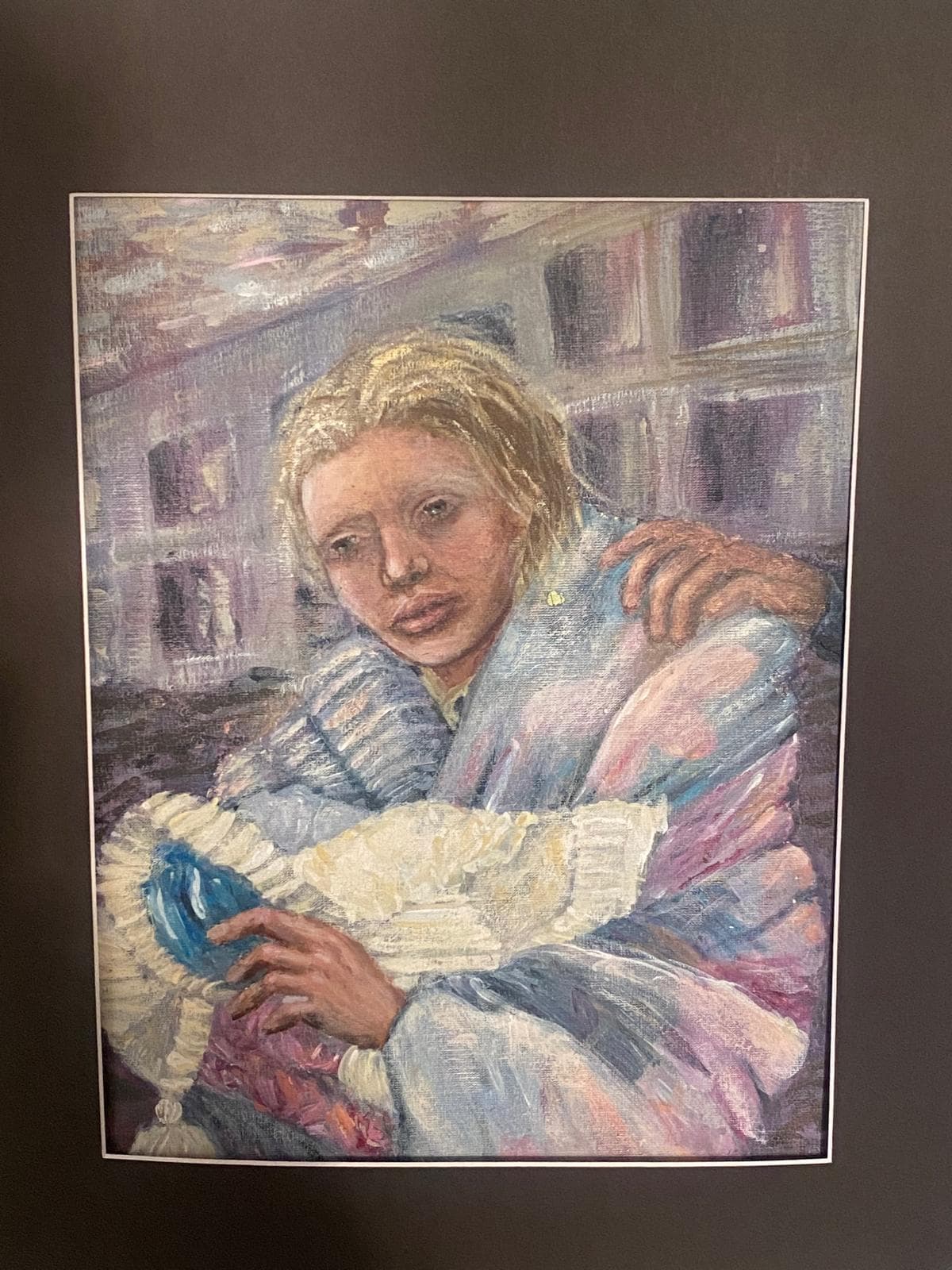 A girl wrapped in a blanket amid destroyed buildings