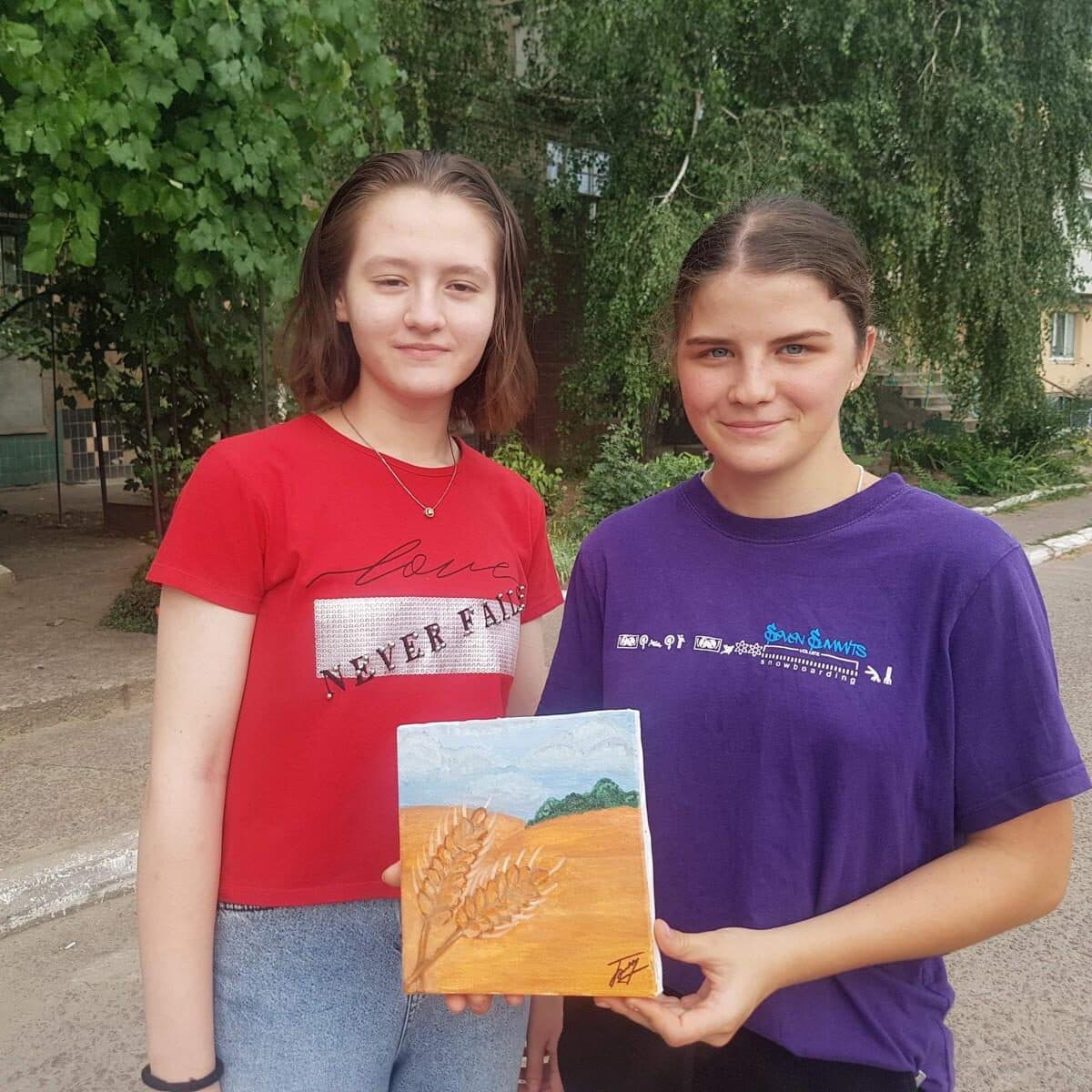 Students from Marhanets with their handmade artwork